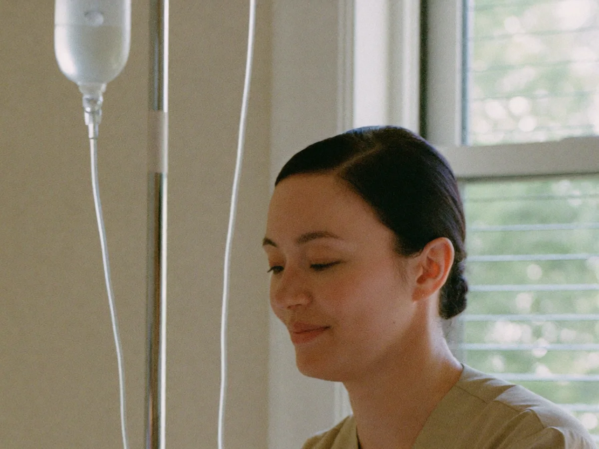 Nurse practitioner beside a neatly prepared IV hydration drip